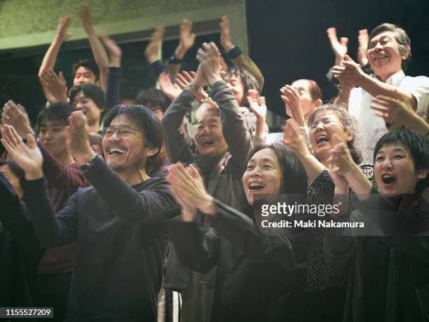 they are standing ovation with smile - only japanese stock pictures, royalty-free photos & images