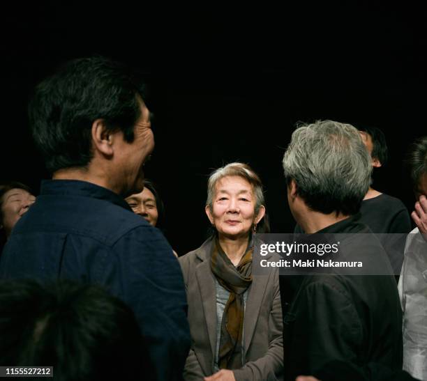 senior lady standing proudly among the people - surrounding ストックフォトと画像
