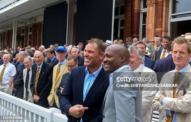 Former Australian cricketer Shane Warne poses with former West Indies cricketer Brian Lara ahead of the start of the 2019 Cricket World Cup final...