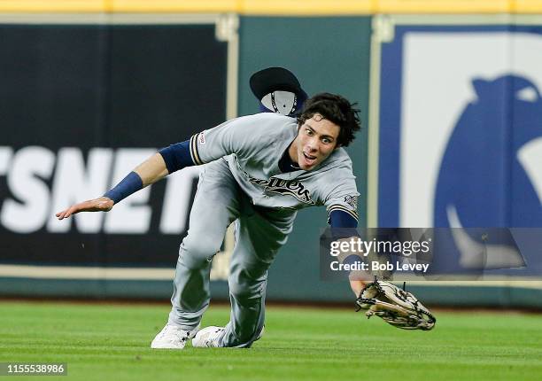 Christian Yelich of the Milwaukee Brewers makes a diving catch on a line drive by Jake Marisnick of the Houston Astros in the third inning at Minute...