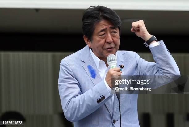 Shinzo Abe, Japan's prime minister and president of the Liberal Democratic Party , gestures as he speaks during an election campaign rally in Kobe,...