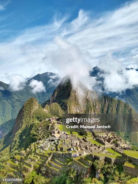 machu picchu between the clouds. the ruins of machu picchu continue to reveal the mysteries of the inca empire. - machu pichu stock pictures, royalty-free photos & images