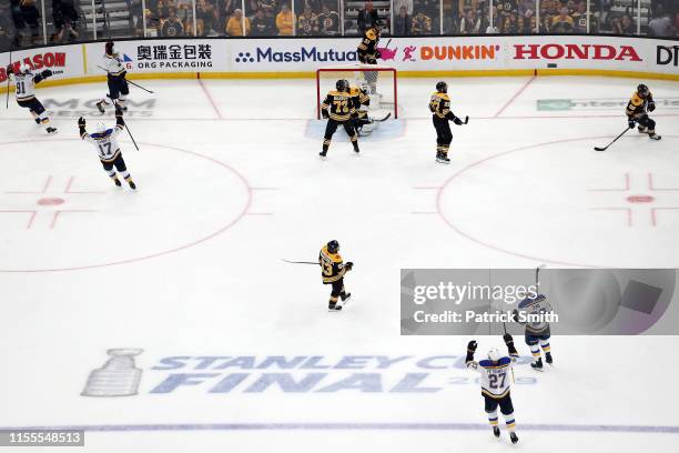 Brayden Schenn of the St. Louis Blues is congratulated by his teammate Vladimir Tarasenko after scoring a third period goal against the Boston Bruins...