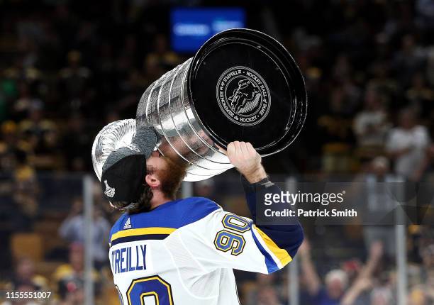Ryan O'Reilly of the St. Louis Blues hoists the cup after defeating the Boston Bruins 4-1 to win Game Seven of the 2019 NHL Stanley Cup Final at TD...