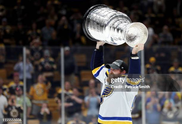 Ryan O'Reilly of the St. Louis Blues hoists the cup after defeating the Boston Bruins 4-1 to win Game Seven of the 2019 NHL Stanley Cup Final at TD...