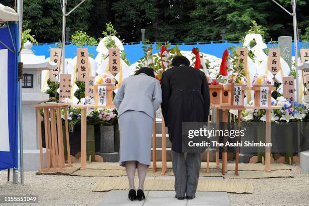 Crown Prince Akishino and Crown Princess Kiko of Akishino bow at an altar during the 5th anniversary memorial to commemorate Prince Katsura at...