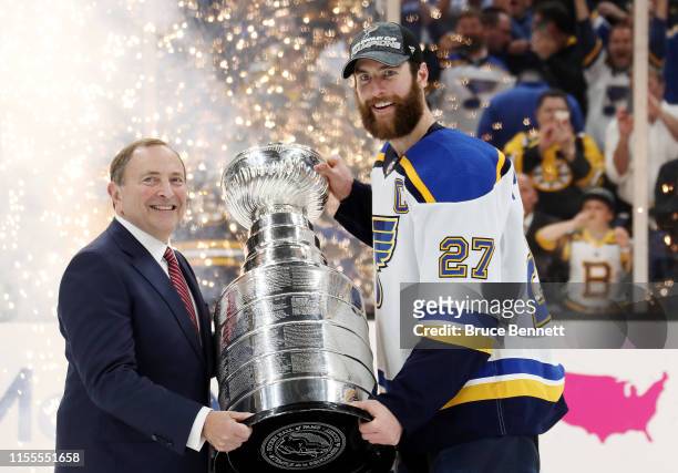 Commisoner Gary Bettman presents Alex Pietrangelo of the St. Louis Blues with the Stanley Cup after defeating the Boston Bruins 4-1 to win Game Seven...