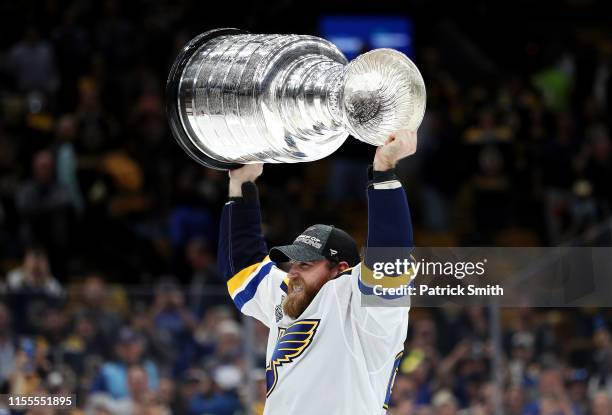 Ryan O'Reilly of the St. Louis Blues hoists the cup after defeating the Boston Bruins 4-1 to win Game Seven of the 2019 NHL Stanley Cup Final at TD...