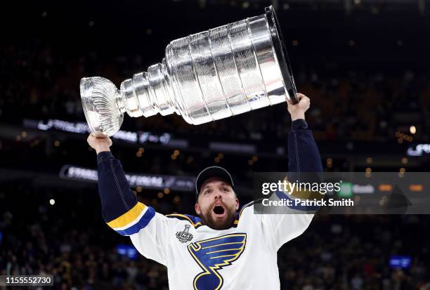 David Perron of the St. Louis Blues celebrates with the Stanley cup after defeating the Boston Bruins in Game Seven of the 2019 NHL Stanley Cup Final...