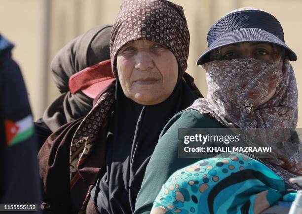 Women attend the launch of LaLiga Zaatari Social Project, at the eponymous Syrian refugee camp in northern Jordan on July 14, 2019. - The first...