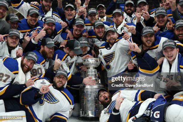 The St. Louis Blues pose for a photo with the Stanley Cup on the ice after the 2019 NHL Stanley Cup Final at TD Garden on June 12, 2019 in Boston,...