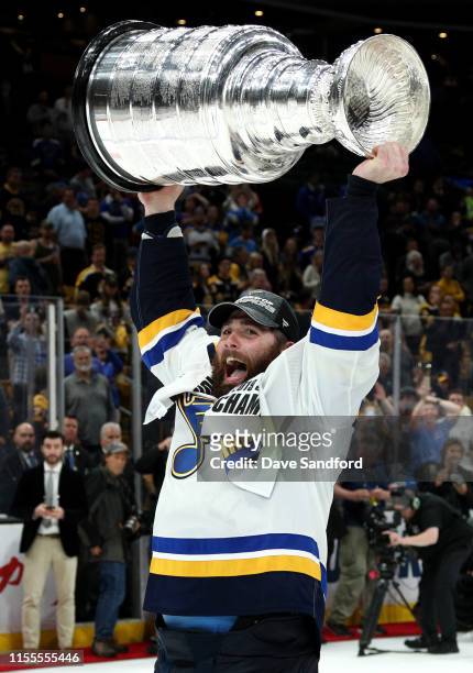 Patrick Maroon of the St. Louis Blues hoists the Stanley Cup on the ice after the 2019 NHL Stanley Cup Final at TD Garden on June 12, 2019 in Boston,...