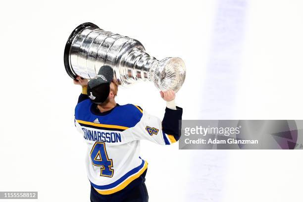 Carl Gunnarsson of the St. Louis Blues celebrates with the Stanley cup after defeating the Boston Bruins in Game Seven of the 2019 NHL Stanley Cup...