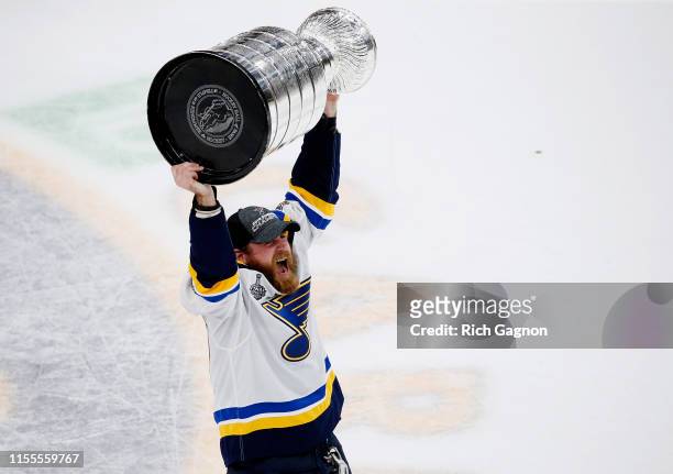 Ryan O'Reilly of the St. Louis Blues hoists the cup after defeating the Boston Bruins 4-1 to win Game Seven of the 2019 NHL Stanley Cup Final at TD...