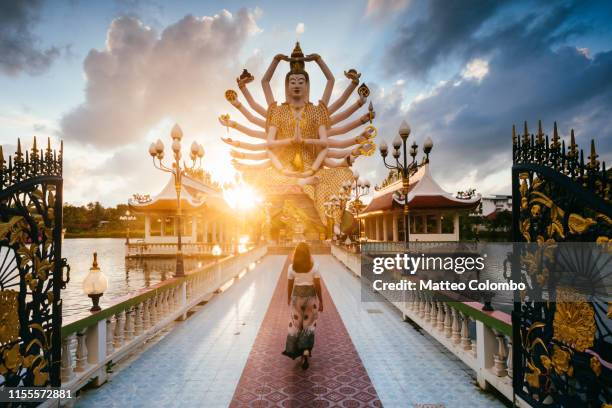 asian woman visiting wat plai laem, ko samui, thailand - samui bildbanksfoton och bilder