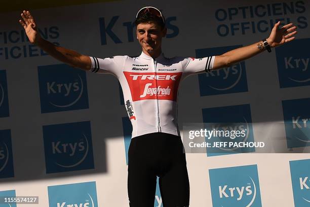 Italy's Giulio Ciccone celebrates his best young's white jersey on the podium of the ninth stage of the 106th edition of the Tour de France cycling...