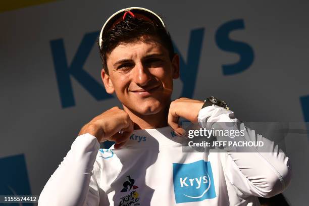 Italy's Giulio Ciccone adjusts his best young's white jersey on the podium of the ninth stage of the 106th edition of the Tour de France cycling race...