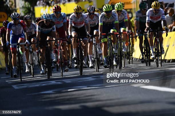 The pack arrives on the finish line of the ninth stage of the 106th edition of the Tour de France cycling race between Saint-Etienne and Brioude, in...