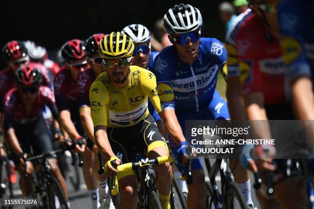 France's Julian Alaphilippe , wearing the overall leader's yellow jersey rides in the pack during the ninth stage of the 106th edition of the Tour de...