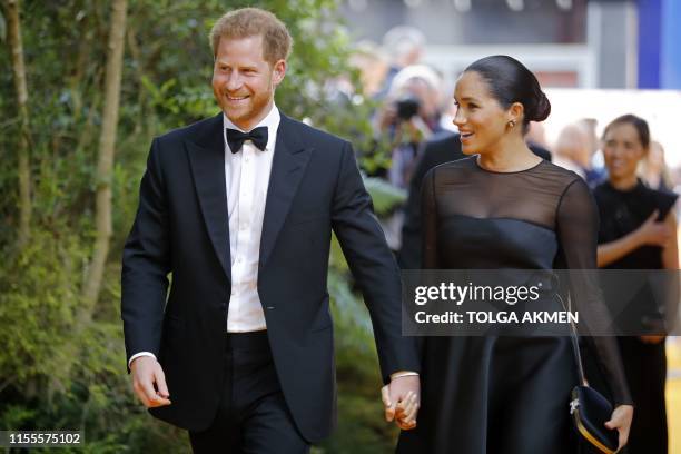 Britain's Prince Harry, Duke of Sussex and Britain's Meghan, Duchess of Sussex arrive for the European premiere of the film The Lion King in London...