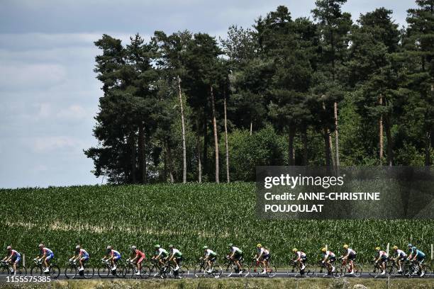 Cyclists of the pack ride during the ninth stage of the 106th edition of the Tour de France cycling race between Saint-Etienne and Brioude, on July...