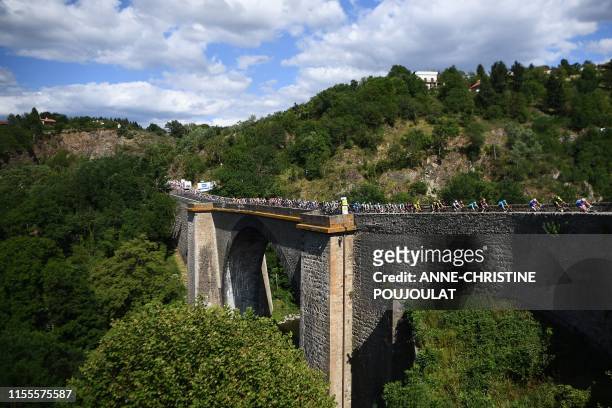 The pack crosses a bridge during the ninth stage of the 106th edition of the Tour de France cycling race between Saint-Etienne and Brioude, on July...