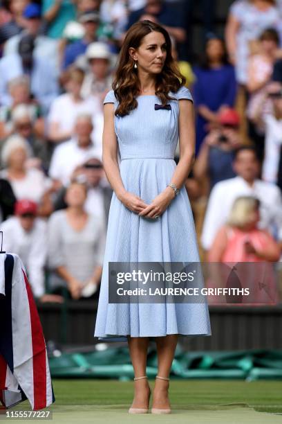 Britain's Catherine, Duchess of Cambridge attends the trophy ceremony after the men's singles final on day thirteen of the 2019 Wimbledon...