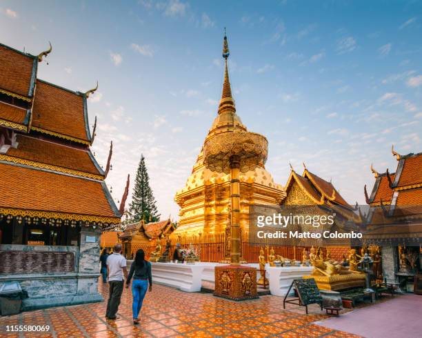 couple visiting wat phra that doi suthep, chiang mai, thailand - chiang mai province stock pictures, royalty-free photos & images