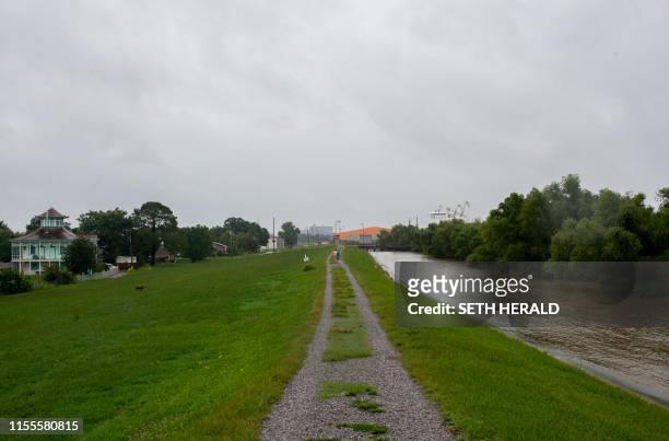 Levee in the 9th ward holds back the Mississippi River from neighborhoods in the 9th ward after Tropical Storm Barry pased through in New Orleans,...
