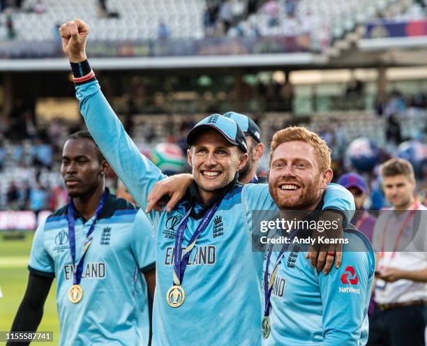 Joe Root and Jonny Bairstow celebrate an England victory during the Final of the ICC Cricket World Cup 2019 between New Zealand and England at Lord's...