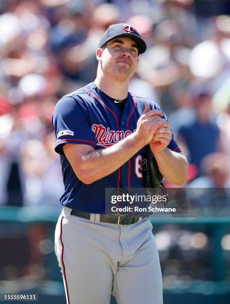 Trevor May of the Minnesota Twins reacts after giving up a solo home run to Carlos Santana of the Cleveland Indians during the seventh inning at...