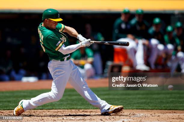 Matt Chapman of the Oakland Athletics hits an RBI ground out during the third inning against the Chicago White Sox at the RingCentral Coliseum on...