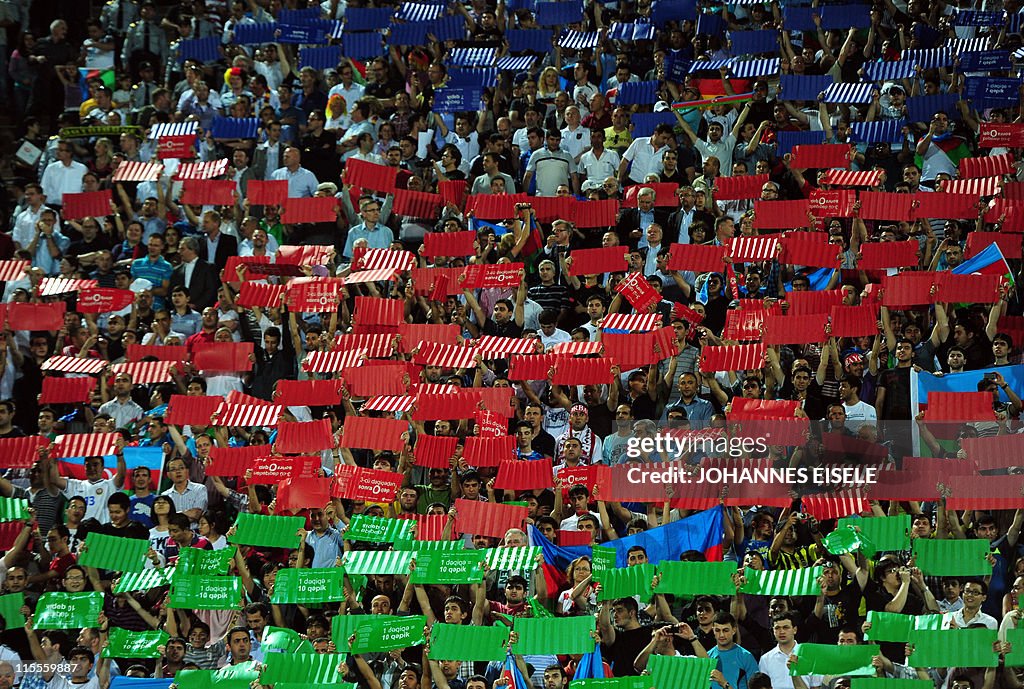 Supporters cheer with placards in their