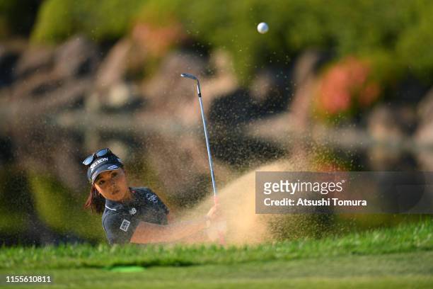 Serena Aoki of Japan hits out from a bunker on the 18th hole during the first round of the Ai Miyazato Suntory Ladies Open Golf Tournament at Rokko...