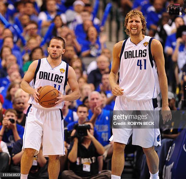 Jose Juan Barea and Dirk Nowitzki of the Dallas Mavericks react to a play during game 4 of the NBA Finals on June 7, 2011 at the American Airlines...