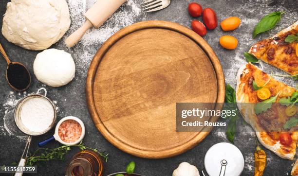 fresh pizza preparing - round chopping board stock pictures, royalty-free photos & images
