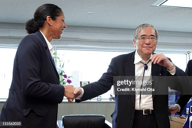 Steffi Jones , President of the Women's World Cup 2011 German Organizing Committee, shakes hands with Junji Ogura, President of the Japan Football...