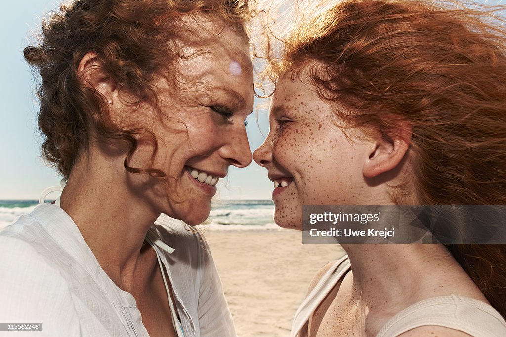 Portrait of mother with daughter, close up