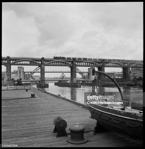 Bridges over the River Tyne, Newcastle upon Tyne, circa 1955-c1980. A general view of the River Tyne, seen from the north bank and looking east, with...