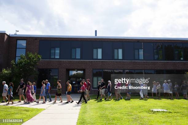 Attendees wait in line before the start of a town hall event with Senator Kamala Harris, a Democrat from California and 2020 presidential candidate,...