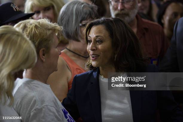 Senator Kamala Harris, a Democrat from California and 2020 presidential candidate, speaks with an attendee during a town hall event in Somersworth,...