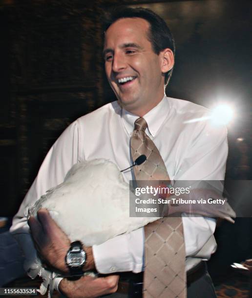 Ruce Bisping/Star Tribune. St. Paul, MN., Monday, . Minnesota Governor Tim Pawlenty held "Lutefisk" the turkey, after being flapped in the head after...
