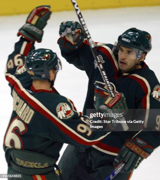 Bbisping@startribune.com Bruce Bisping/Star Tribune. St. Paul, MN., Tuesday, . Wild's Pierre-Marc Bouchard celebrated with Alexandre Daigle after...