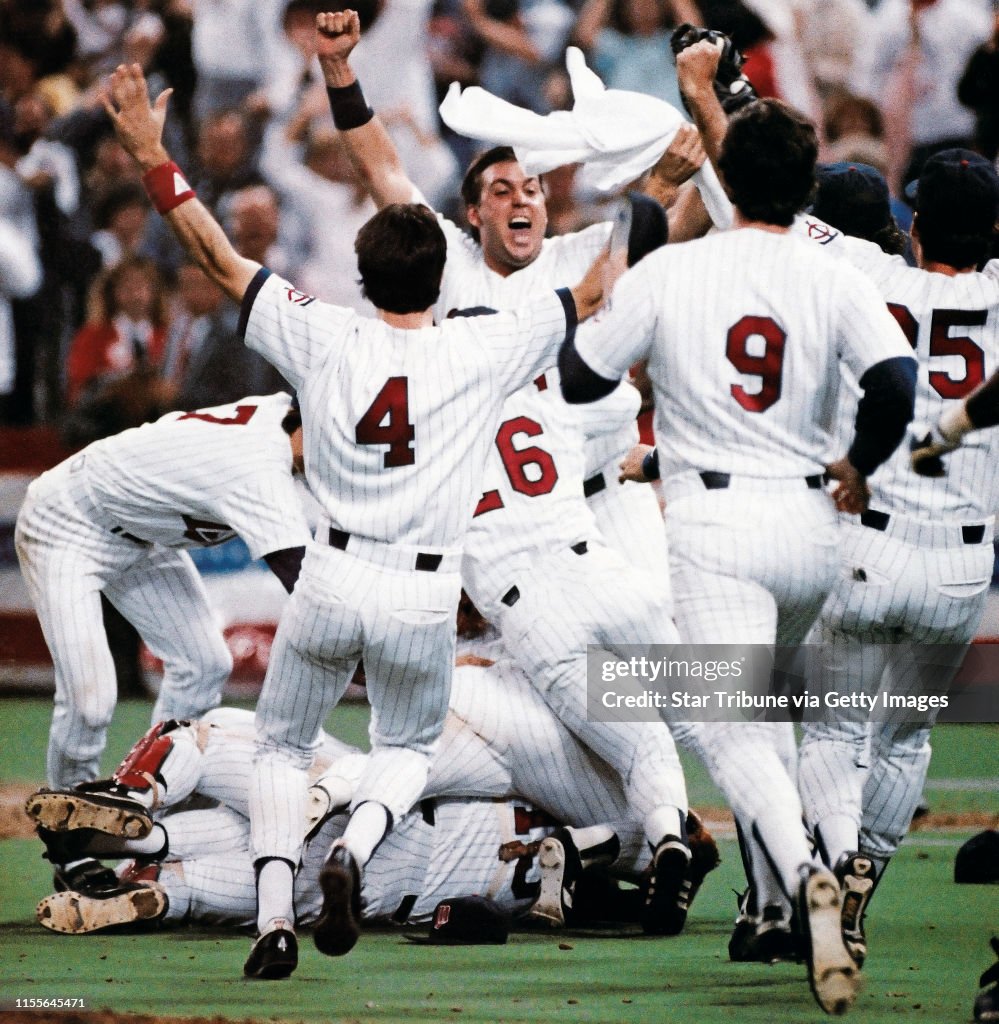 Arms waved and towels twirled on the Metrodome infield after the Twins recorded the final out in their 4-2 victory over the St. Louis Cardinals in the seventh game of the 1987 World Series Sunday night. Jubilant fans turned downtown Minneapolis into a vir