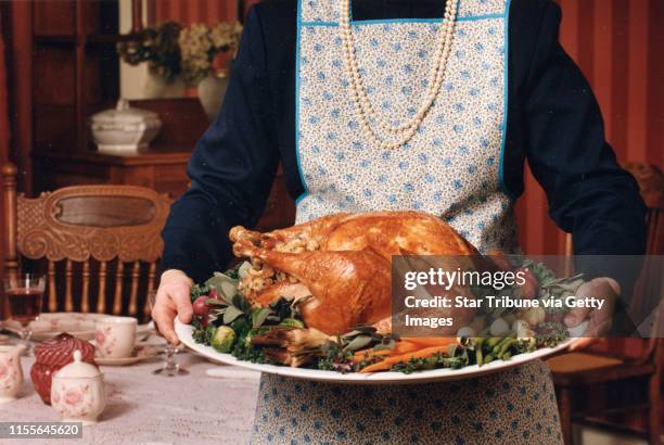 Thanksgiving dinner with cooked turkey -- Star Tribune staff photo, early or mid-November 1994, by Rita Reed.