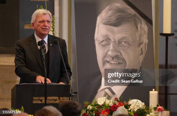 Volker Bouffier, Governor of the state of Hesse, delivers the eulogy while standing next to a portrait of murdered German politician Walter Lübcke at...