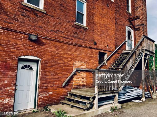 entrance ways to brick commercial building - back door stock pictures, royalty-free photos & images