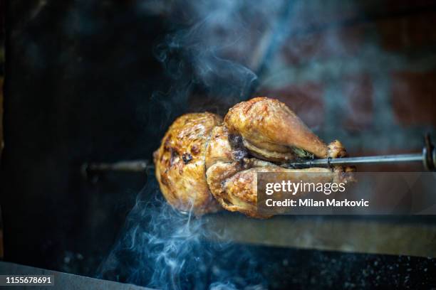 roast chicken on the bbq - spit stock pictures, royalty-free photos & images