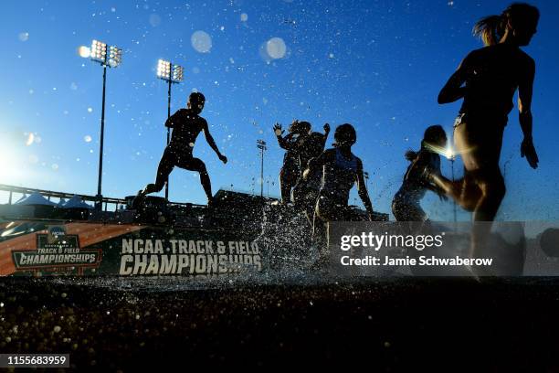 Runners compete in the 3000 meter steeplechase preliminaries during the Division I Men's and Women's Outdoor Track & Field Championships held at Mike...