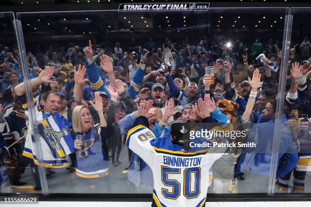 Jordan Binnington of the St. Louis Blues celebrates with fans after defeating the Boston Bruins in Game Seven to win the 2019 NHL Stanley Cup Final...